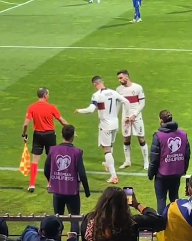 Shocking moment furious Cristiano Ronaldo is hurt by pitch invader trying to take selfie during Portugal clash - Bóng Đá