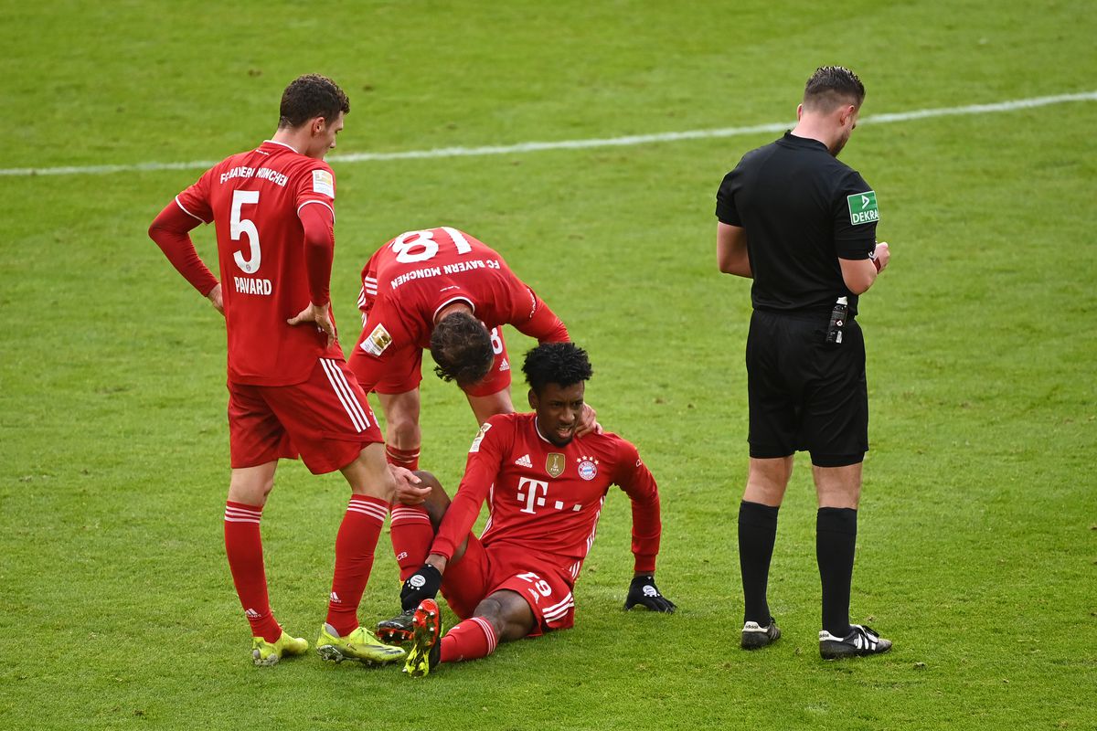 Kingsley Coman went to ground in evident pain. - Bóng Đá